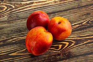 Ripe sweet juicy fresh red nectarines photo