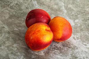 Ripe sweet juicy fresh red nectarines photo