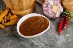 Indian curry sauce in the bowl photo