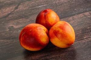 Ripe sweet juicy fresh red nectarines photo