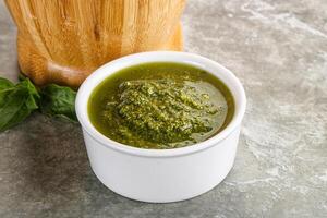 Homemade vegetarian basil pesto sauce photo