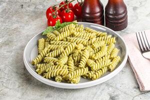 Italian pasta with basil pesto photo