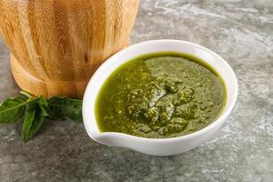 Homemade vegetarian basil pesto sauce photo