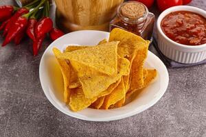 Mexican corn nachos chips with salsa photo