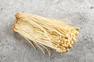 Tasty raw enoki mushroom heap photo