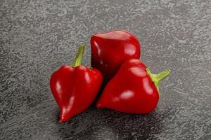 Red spicy cherry pepper heap photo