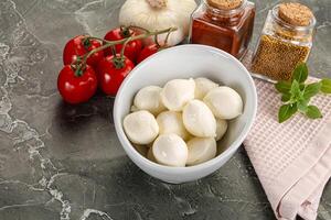 Mini mozarella cheese bolls heap photo