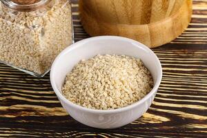 Sesame seeds heap in the bowl photo