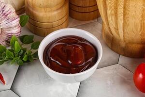 Tasty barbecue sauce in the bowl photo