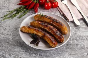 Grilled meat sausages with spices photo