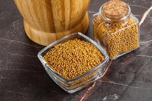 Mustard dry seeds in the bowl photo