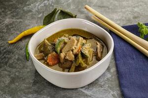 Thai green curry soup with basil photo