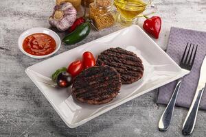 Grilled burger cutlet with sauce photo