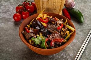 Asian wok with noodle, vegetables and beef photo