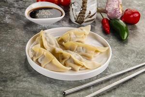 Japanese cuisine - dumplings gyoza with sauce photo