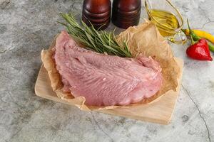 Raw turkey breat fillet for cooking photo