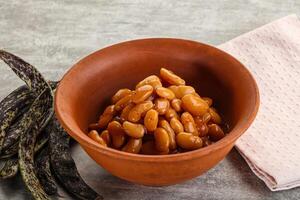 Canned white bean in tomato sauce photo