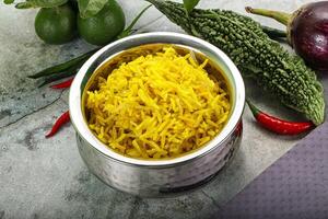 Indian cuisine - Lemon rice with spices photo