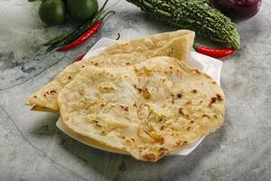 Indian tandori bread - naan with cheese photo