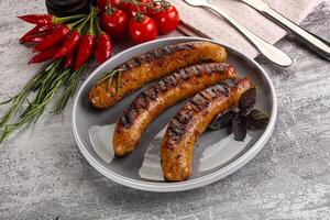 Grilled meat sausages with spices photo