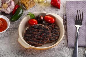 Grilled burger cutlet with sauce photo