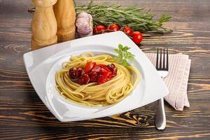 Italian pasta spaghetti with tomato photo