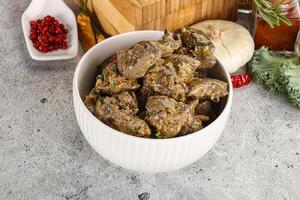 Chicken liver in cream sauce photo