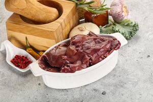 Raw uncooked chicken liver in the bowl photo