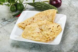 Indian tandori bread - naan with cheese photo