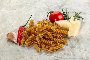 Raw whole grain pasta fusilli photo