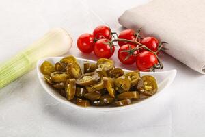 Sliced canned jalapeno pepper photo