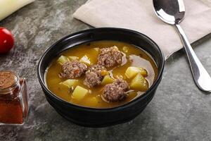 Soup with beef meatball and vegetables photo