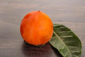 Fresh ripe sweet juicy persimmon photo