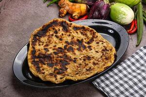 Indian cuisine stuffed Aloo paratha photo