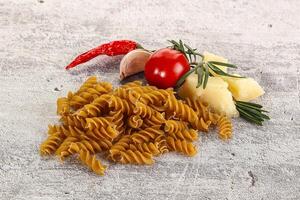 Raw whole grain pasta fusilli photo