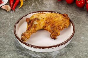 Roasted chicken leg with spices photo