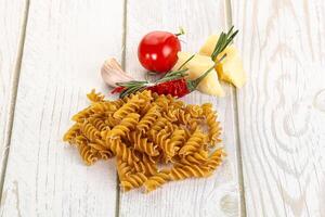 Raw whole grain pasta fusilli photo