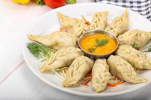 Steamed asian dumpling momo with meat photo