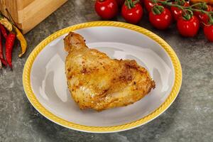 Roasted chicken leg with spices photo