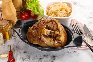 Baked pork knee with spices photo