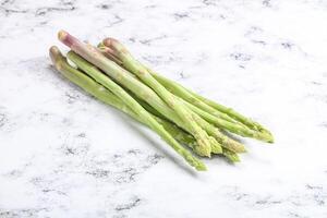 Raw green uncooked asparagus sprout photo