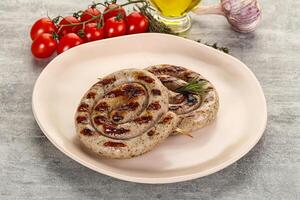 Grilled natural spiral meat sausage photo