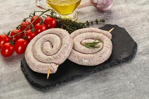 Natural spiral sausage for grill photo