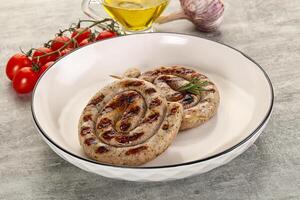 Grilled natural spiral meat sausage photo