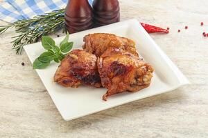 Roasted chicken leg with spicy sauce photo