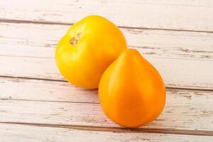 Ripe yellow bright juicy tomato photo