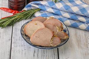 Baked pork tenderloin served rosemary photo