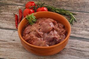 Raw chicken liver in the bowl photo