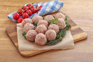 Raw pork meatball for cooking photo