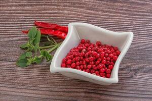 Red pepper seeds in the bowl photo